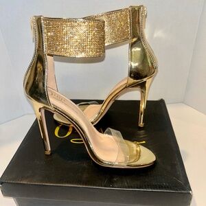 Olivia Ferragamo Gold Patent Heels